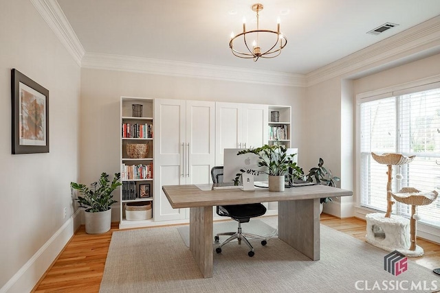 office area with an inviting chandelier, crown molding, light wood-style floors, and visible vents