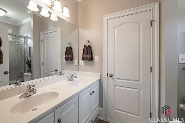 full bath featuring a sink, an enclosed shower, toilet, and double vanity