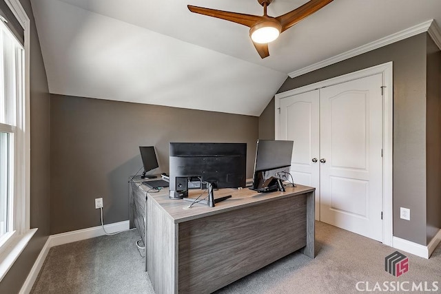 office area with lofted ceiling, a ceiling fan, light colored carpet, and baseboards