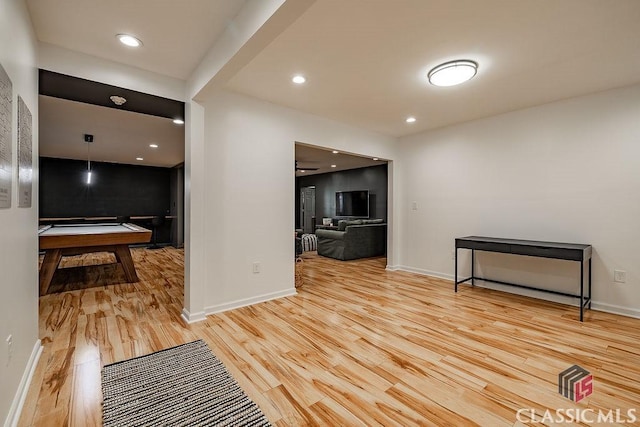 interior space featuring recessed lighting, light wood-style flooring, and baseboards