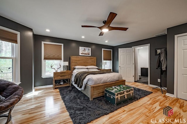 bedroom featuring visible vents, baseboards, recessed lighting, light wood-style flooring, and a ceiling fan