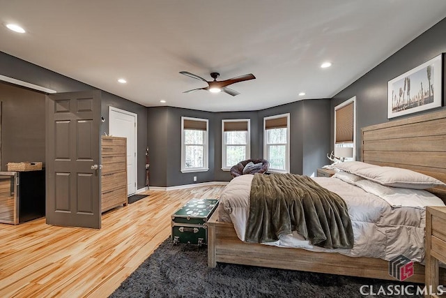 bedroom featuring recessed lighting, a ceiling fan, light wood-type flooring, and baseboards