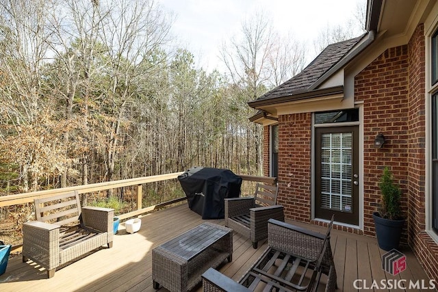 wooden deck with area for grilling