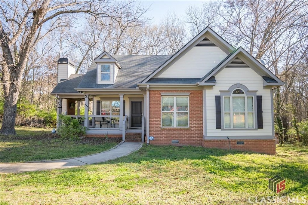 120 Georgia Railroad St, Athens, GA 30601 - view of front of house with a porch, a front yard, crawl space, brick siding, and a chimney