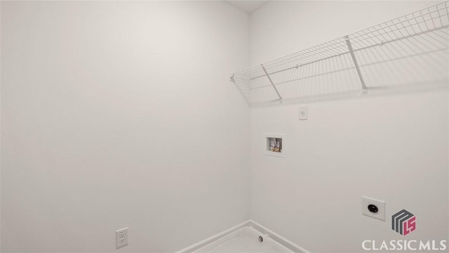 laundry room featuring electric dryer hookup, washer hookup, and laundry area
