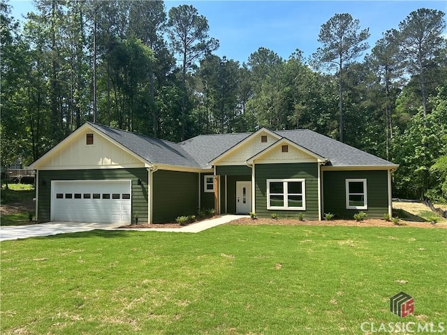 2850 Caboose Ct, Greensboro, GA 30642 - view of front of property with board and batten siding, an attached garage, concrete driveway, and a front yard