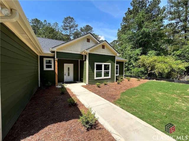 2850 Caboose Ct, Greensboro, GA 30642 - view of front of property featuring a shingled roof and a front yard