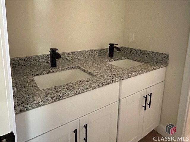 2850 Caboose Ct, Greensboro, GA 30642 - bathroom with double vanity and a sink