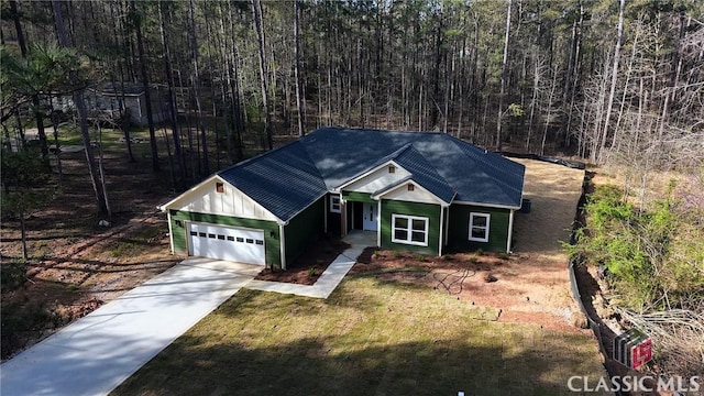 2850 Caboose Ct, Greensboro, GA 30642 - ranch-style home featuring an attached garage, driveway, and a forest view