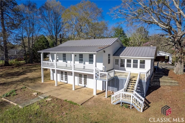 1050 Eugene Ln, Madison, GA 30650 - rear view of property with a patio area, stairway, a standing seam roof, french doors, and metal roof