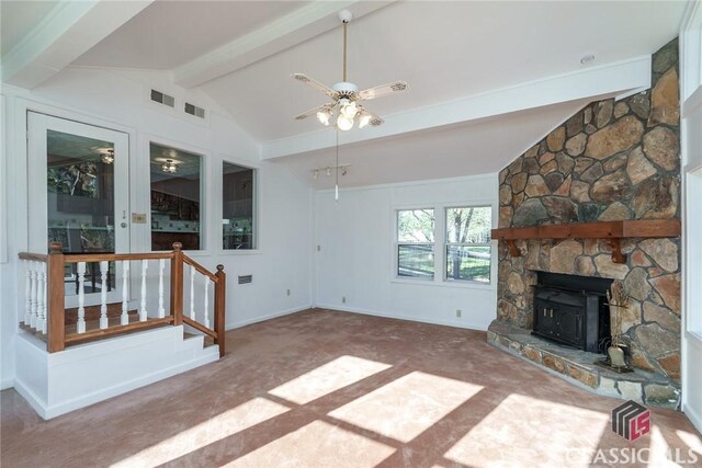 1050 Eugene Ln, Madison, GA 30650 - unfurnished living room with lofted ceiling with beams, baseboards, visible vents, ceiling fan, and carpet