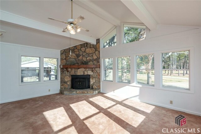 1050 Eugene Ln, Madison, GA 30650 - unfurnished living room with a healthy amount of sunlight, beamed ceiling, carpet flooring, and a ceiling fan