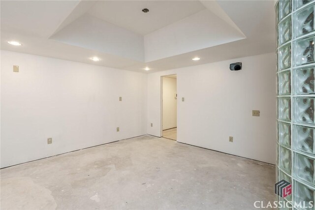 1050 Eugene Ln, Madison, GA 30650 - unfurnished room featuring concrete flooring, a tray ceiling, and recessed lighting