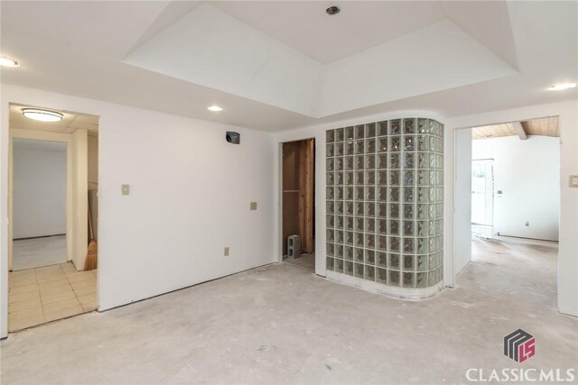 1050 Eugene Ln, Madison, GA 30650 - spare room featuring unfinished concrete flooring and a raised ceiling