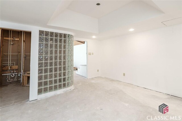 1050 Eugene Ln, Madison, GA 30650 - unfurnished room featuring a tray ceiling and concrete flooring