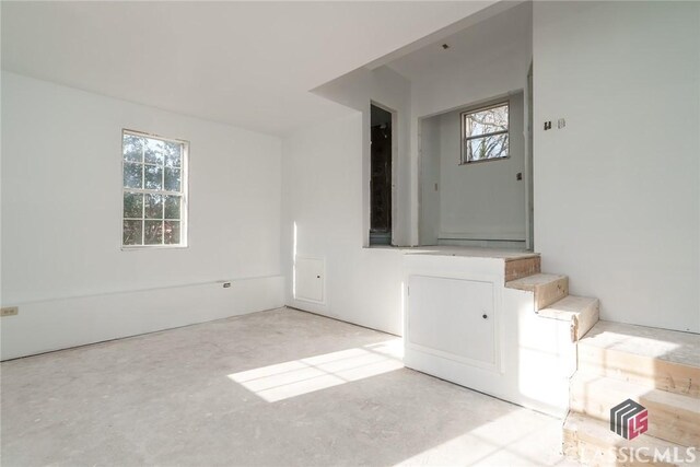 1050 Eugene Ln, Madison, GA 30650 - entrance foyer featuring unfinished concrete flooring and plenty of natural light