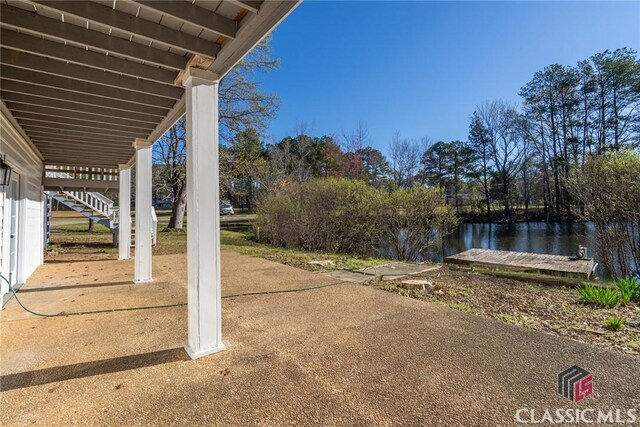 1050 Eugene Ln, Madison, GA 30650 - view of yard featuring stairs and a water view