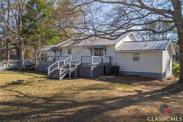 1050 Eugene Ln, Madison, GA 30650 - back of house with central AC unit, metal roof, and a wooden deck