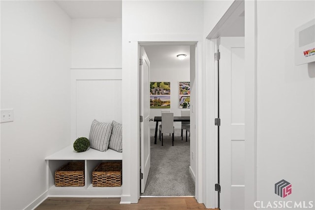 mudroom with baseboards and wood finished floors