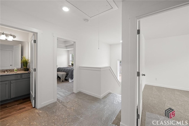 ensuite bathroom with baseboards, ensuite bathroom, vanity, and recessed lighting