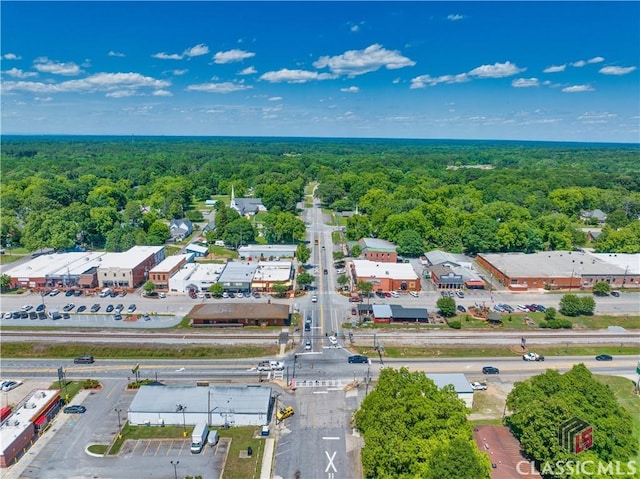 drone / aerial view featuring a view of trees