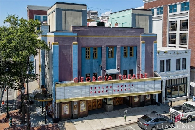 view of building exterior featuring uncovered parking