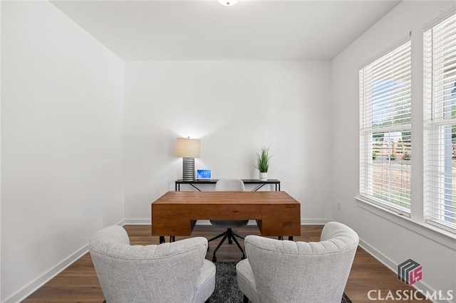 office area featuring baseboards and wood finished floors