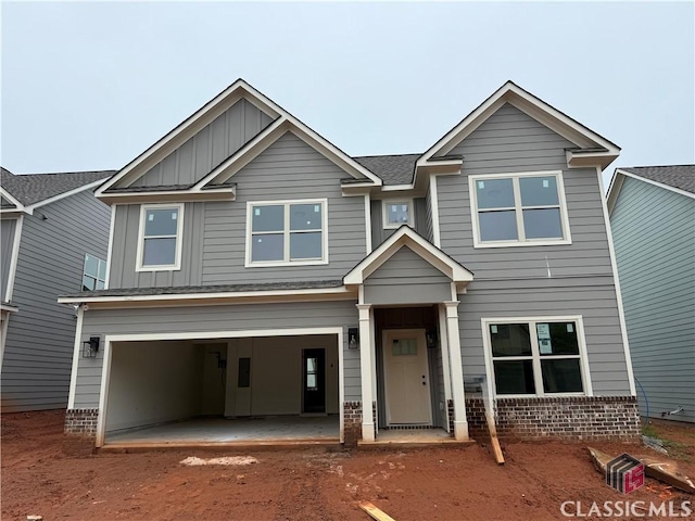 337 Ridge Pointe Dr, Athens, GA 30606 - view of front of home featuring board and batten siding, driveway, and a garage
