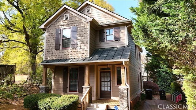 craftsman house with covered porch, a standing seam roof, and metal roof
