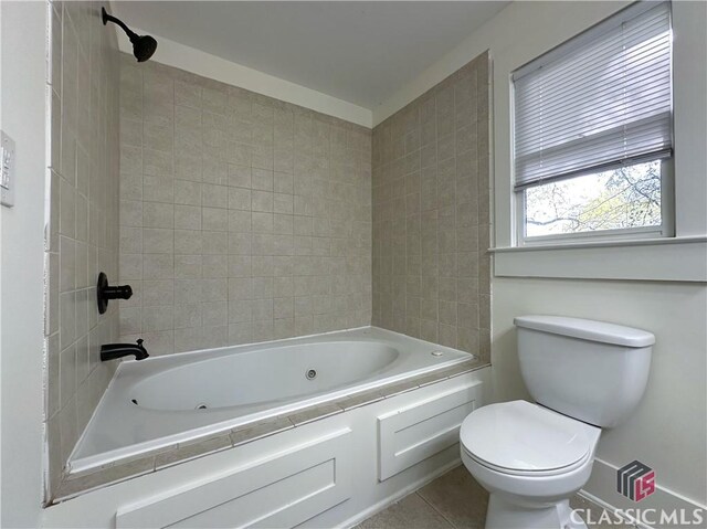 full bath with toilet and tile patterned floors