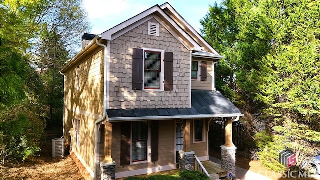 craftsman inspired home featuring a porch and central air condition unit