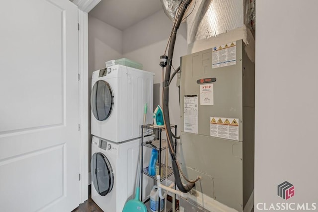 washroom featuring laundry area and stacked washing maching and dryer