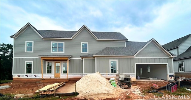 1255 Melody Bnd Unit 2, Watkinsville, GA 30677 - rear view of house featuring board and batten siding, roof with shingles, and a garage