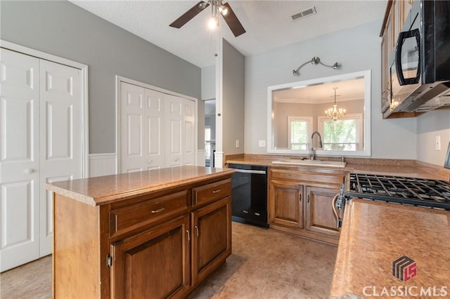 kitchen featuring light countertops, black appliances, visible vents, ceiling fan with notable chandelier, and a sink