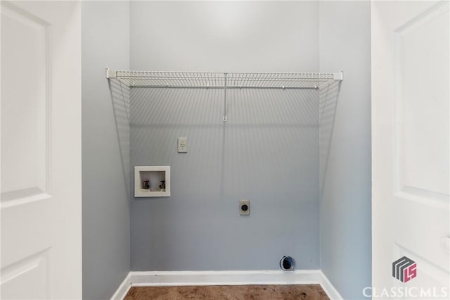 laundry area featuring baseboards, electric dryer hookup, laundry area, and washer hookup