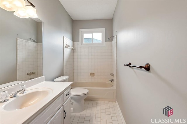 full bath with toilet, vanity, tile patterned flooring, and shower / washtub combination