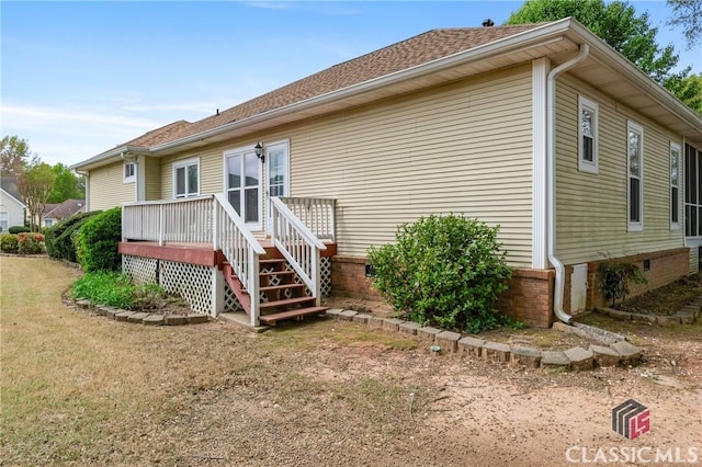 back of property with a deck