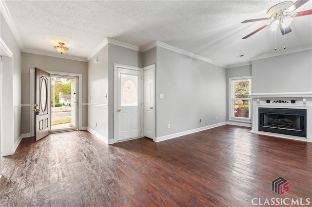 unfurnished living room featuring a textured ceiling, wood finished floors, and plenty of natural light