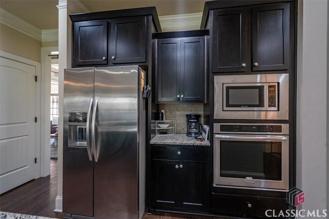 1296 Club Estates Rd, Statham, GA 30666 - kitchen with tasteful backsplash, appliances with stainless steel finishes, crown molding, light stone countertops, and dark wood-type flooring