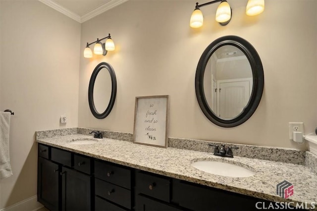 1296 Club Estates Rd, Statham, GA 30666 - bathroom with a sink, baseboards, double vanity, and crown molding