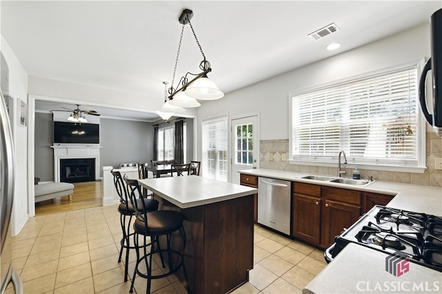 340 Hammersmith Dr, Suwanee, GA 30024 - kitchen with stainless steel dishwasher, a sink, light tile patterned flooring, a ceiling fan, and light countertops