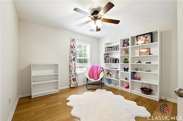 340 Hammersmith Dr, Suwanee, GA 30024 - living area with wood finished floors, a ceiling fan, and baseboards