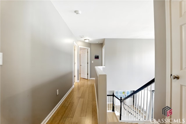 340 Hammersmith Dr, Suwanee, GA 30024 - hall featuring an upstairs landing, light wood-style floors, and baseboards