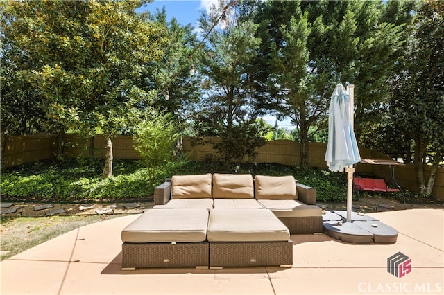 340 Hammersmith Dr, Suwanee, GA 30024 - fenced backyard featuring a patio and outdoor lounge area