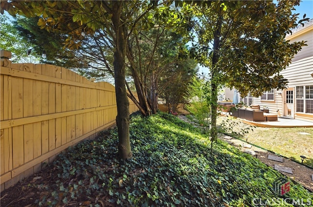 340 Hammersmith Dr, Suwanee, GA 30024 - fenced backyard featuring outdoor lounge area and a patio area