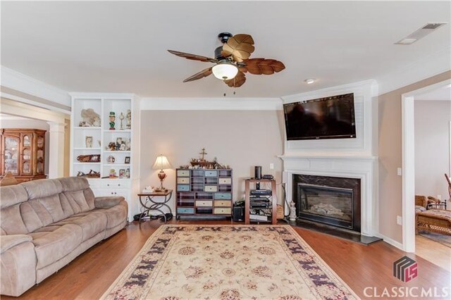 6706 Mill Rock Ct, Hoschton, GA 30548 - living room featuring wood finished floors, baseboards, and recessed lighting