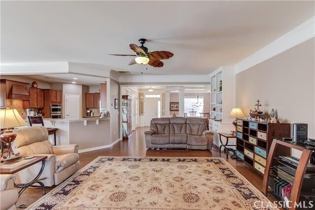 6706 Mill Rock Ct, Hoschton, GA 30548 - dining space with dark wood-type flooring, visible vents, baseboards, and an inviting chandelier