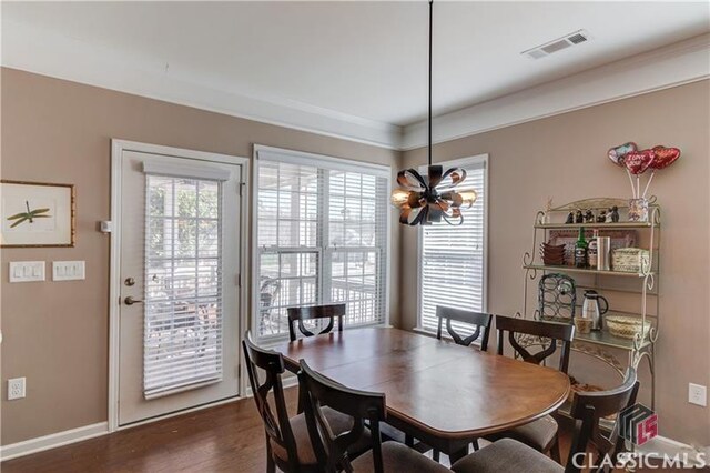 6706 Mill Rock Ct, Hoschton, GA 30548 - dining space with crown molding, ceiling fan, light wood-type flooring, a glass covered fireplace, and baseboards