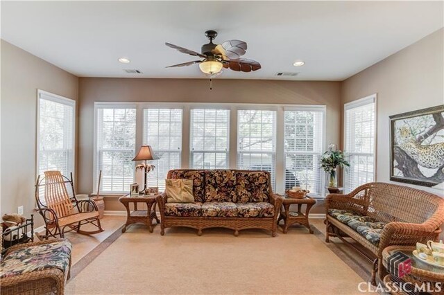 6706 Mill Rock Ct, Hoschton, GA 30548 - living area featuring a healthy amount of sunlight, baseboards, visible vents, and recessed lighting