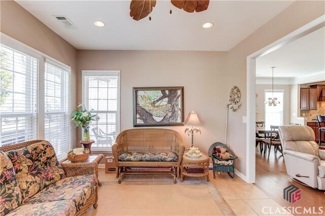 6706 Mill Rock Ct, Hoschton, GA 30548 - interior space featuring a raised ceiling, wood finished floors, and a ceiling fan